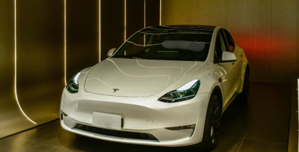 Tesla vehicle on display in Bangkok, highlighting Tesla Autopilot technology features and design.