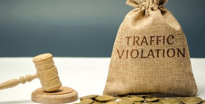 A straw bag with traffic violations written on it