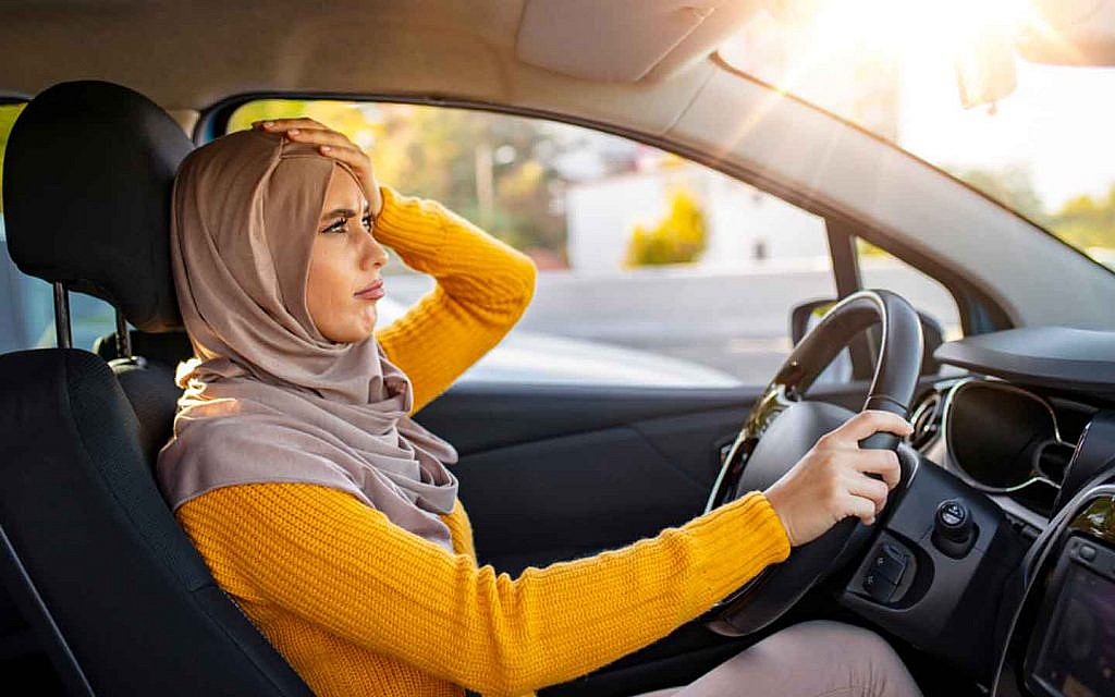 a woman panicking after breaking traffic law