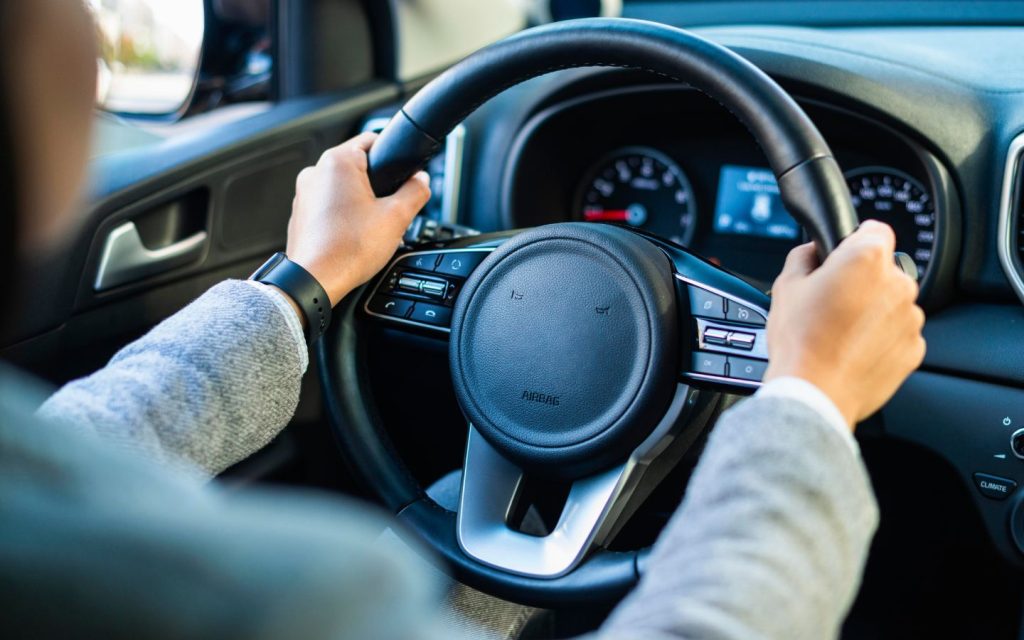 A woman turning a vehicle
