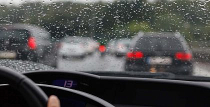 Man driving his car on a rainy day