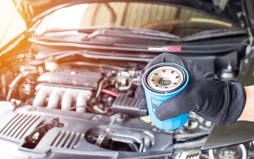 Mechanic holding an oil filter