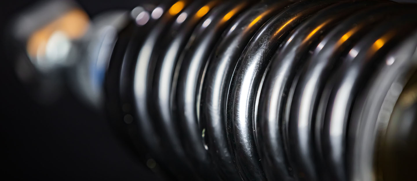 A closeup view of a coilover suspension