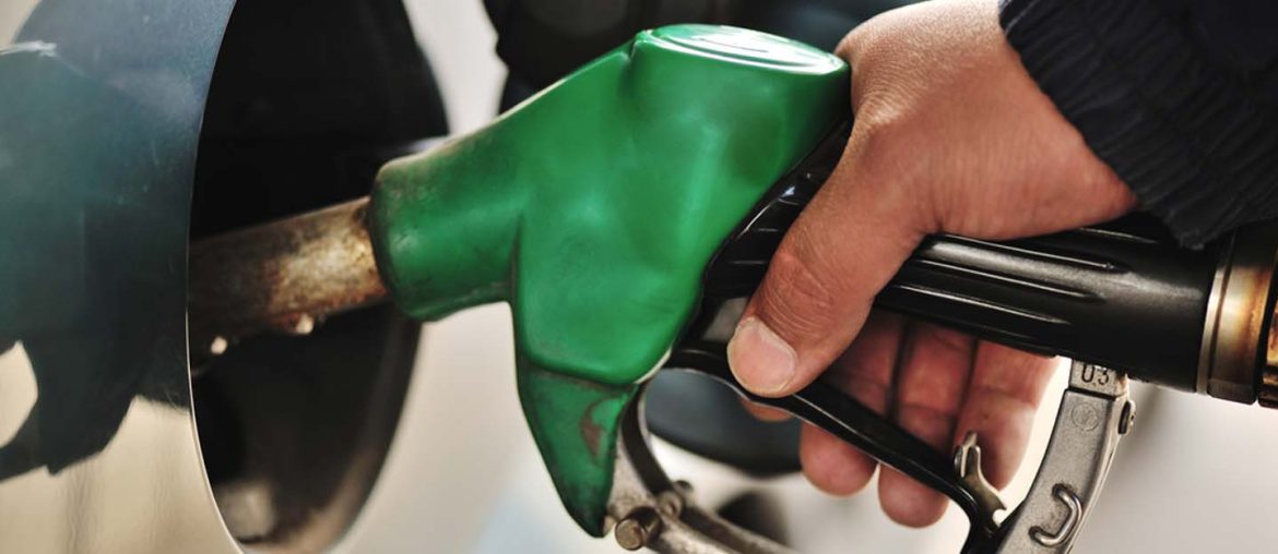 man refueling his car