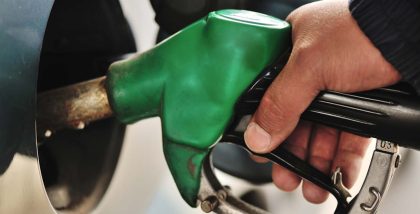 man refueling his car