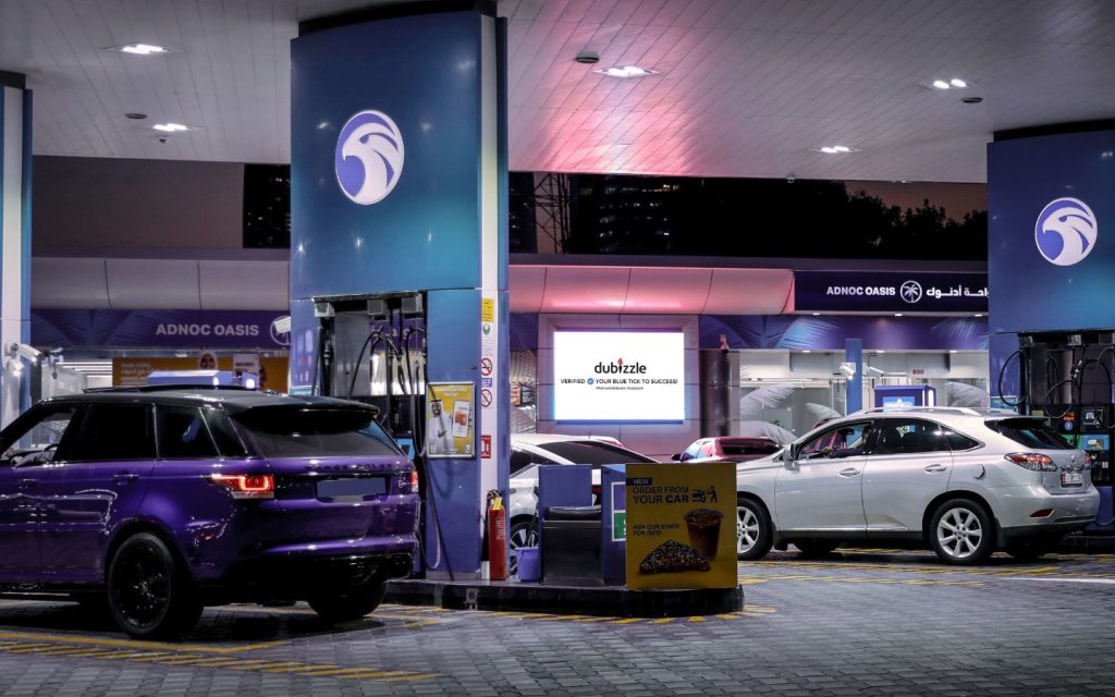 Cars getting fueled up at a petrol station