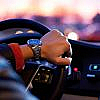 A driver with hands on steering
