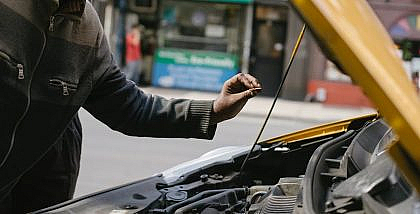 man checking engine