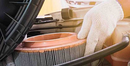 A man changing air filter