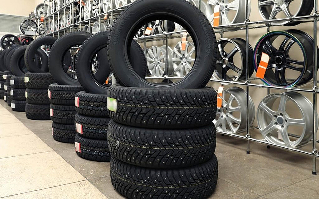 Car tires stacked in an auto shop