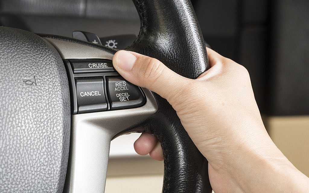 Cruise control button on steering wheel