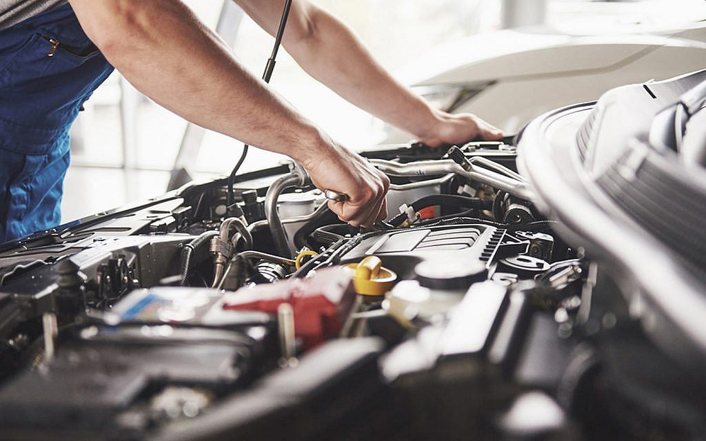 A man making car repairs