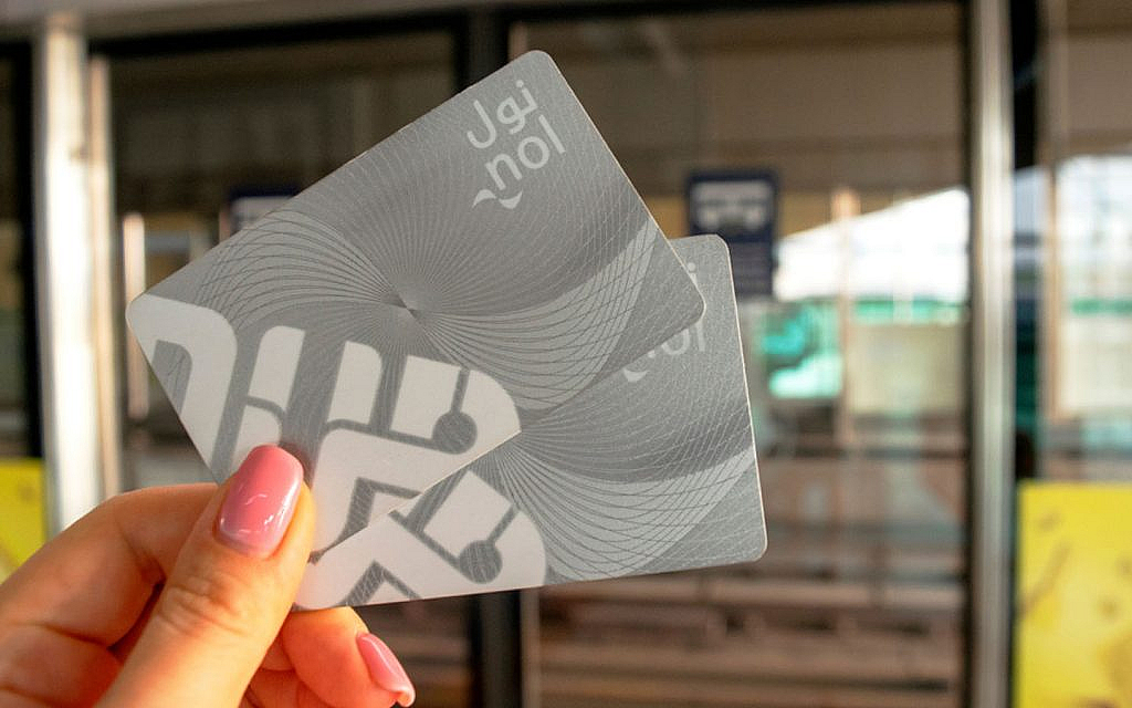 A woman holding a nol card 