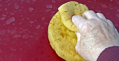 Removing water spots on a car with a cloth