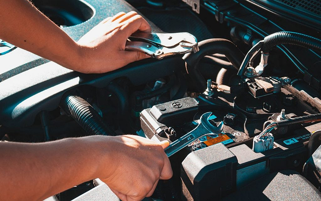 A technician checking car