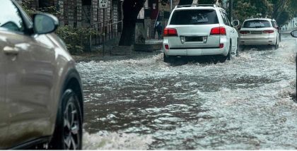 cars moving in flooded waters