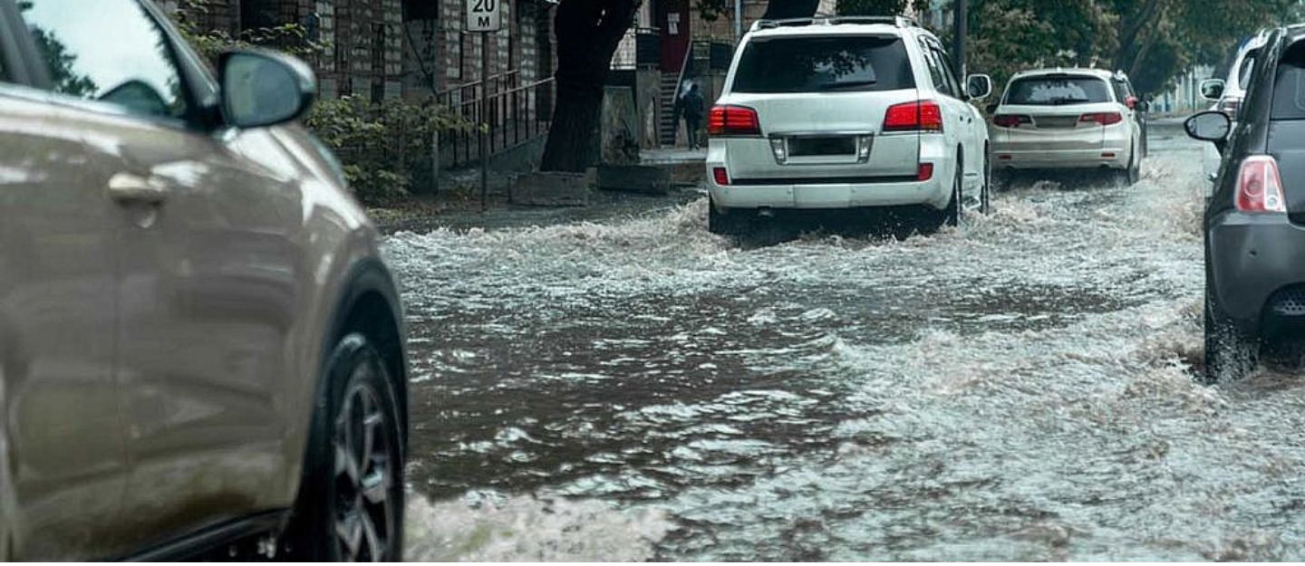 cars moving in flooded waters