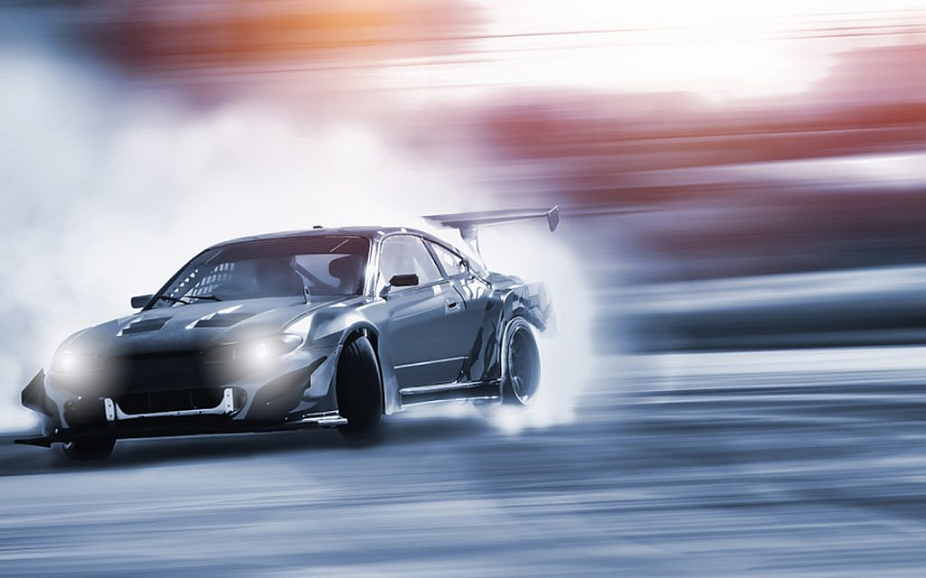 A sports car speeding through the track