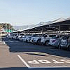 Vehicles under car parking shades