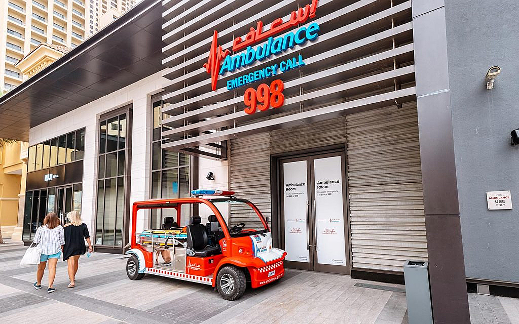 A small emergency vehicle in front of the emergency room