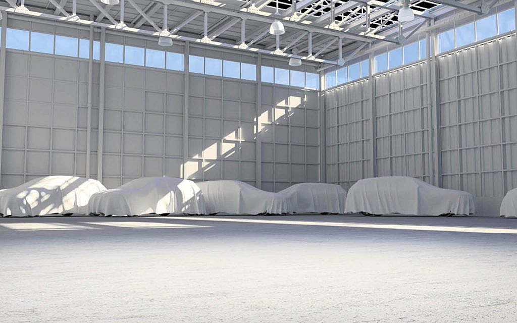 Luxury cars covered with a car cloth for safety and maintenance purposes