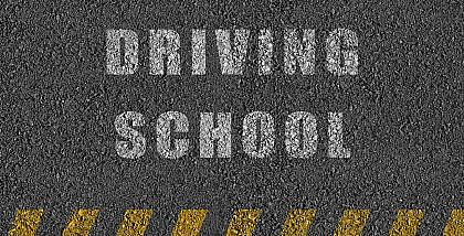 driving school written on the road