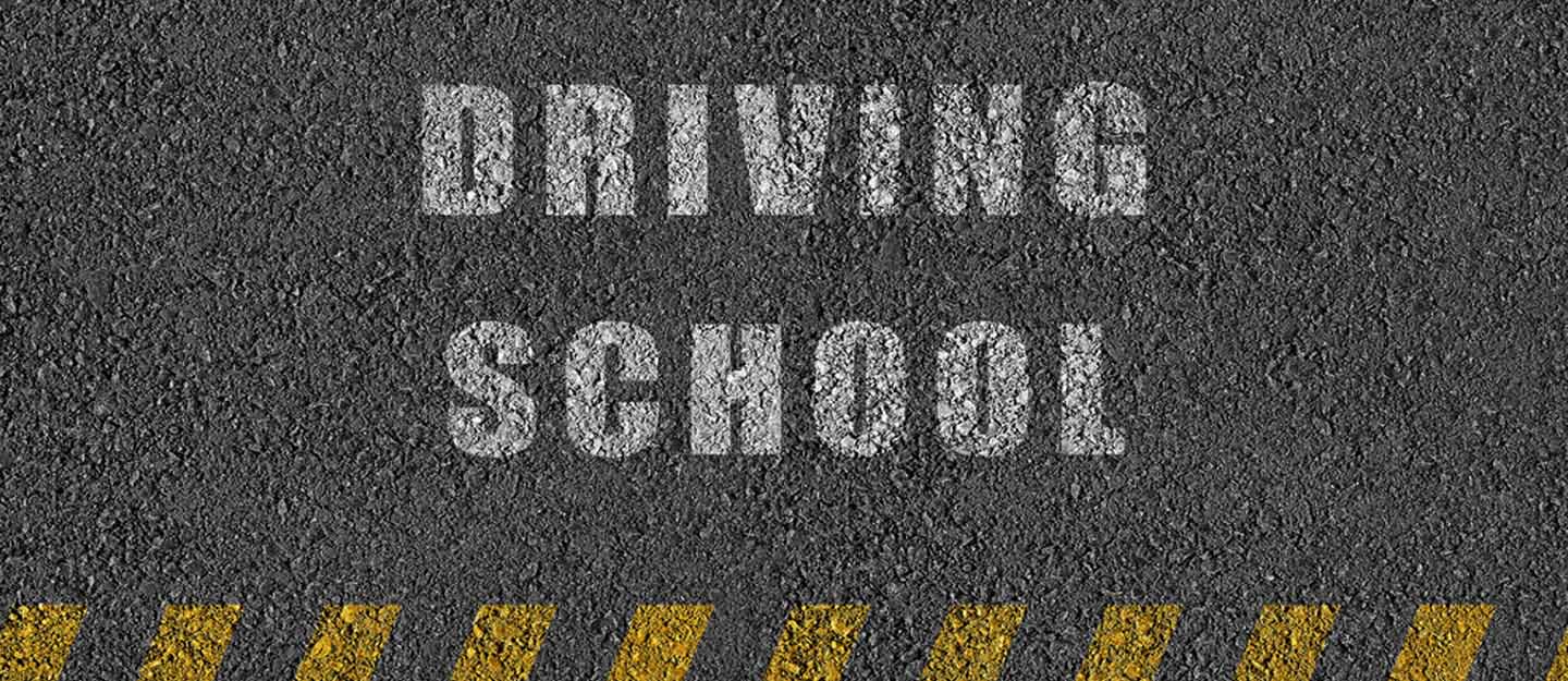 driving school written on the road