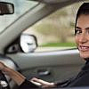 A woman driving a borrowed car