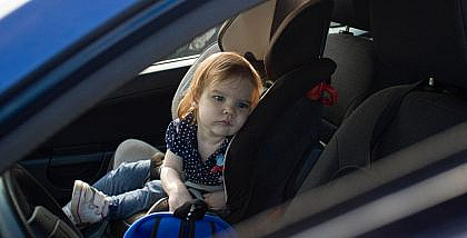 Girl sitting unattended in a car