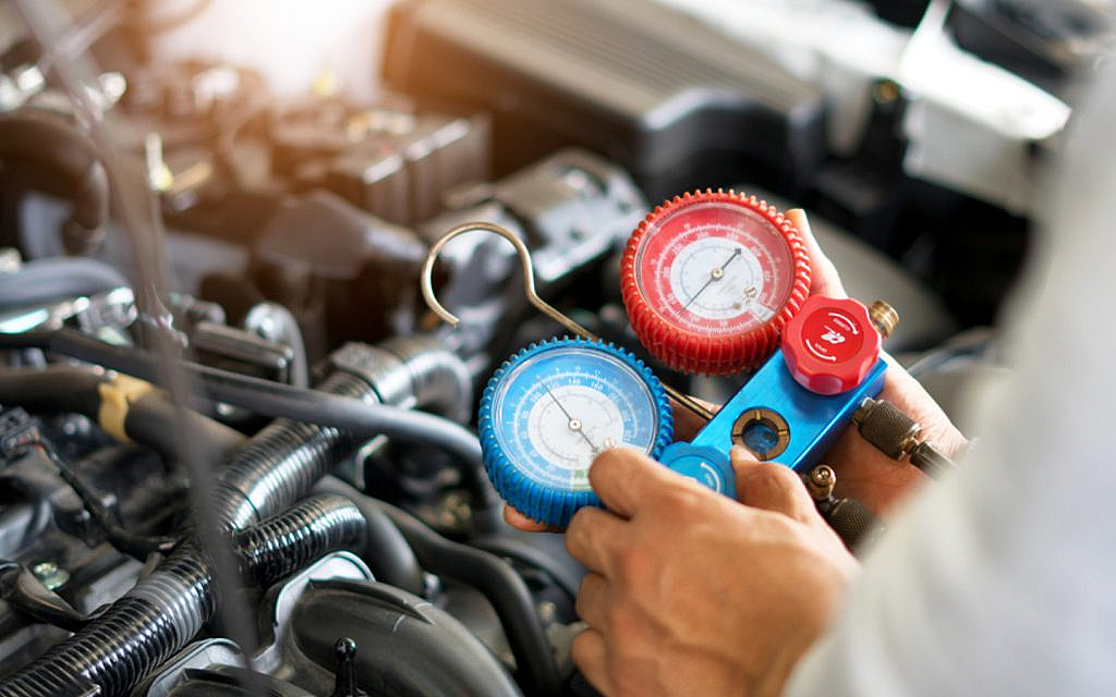 A person checking the engine