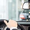 Driver looking in his car’s rearview mirror