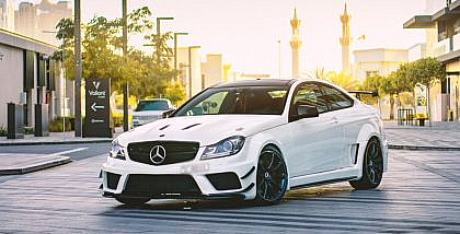 A Mercedes Benz C63 AMG parked on a road in Dubai