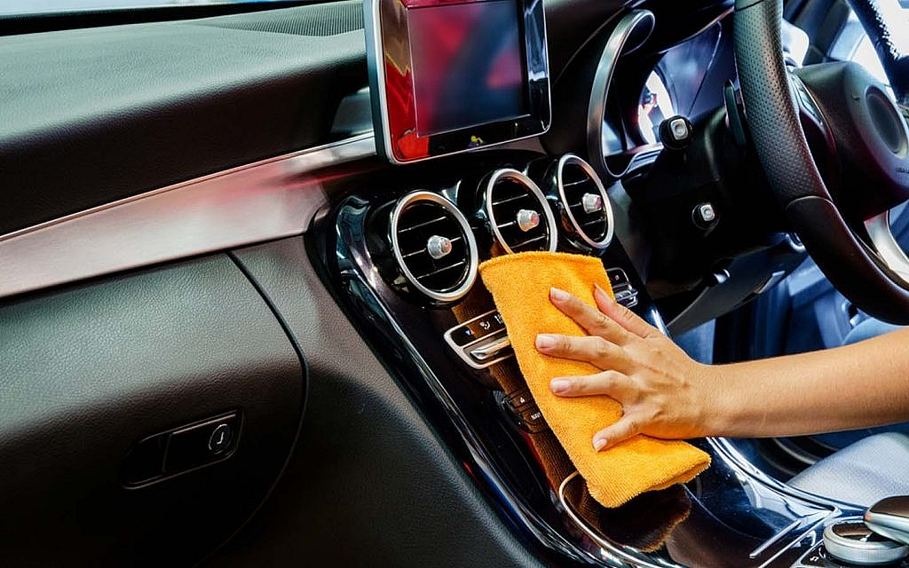 Cleaning car interior with a microfiber cloth