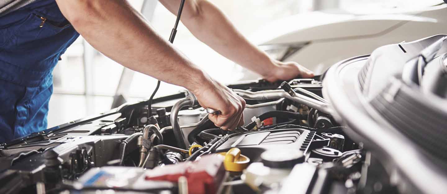 A man repairing a car