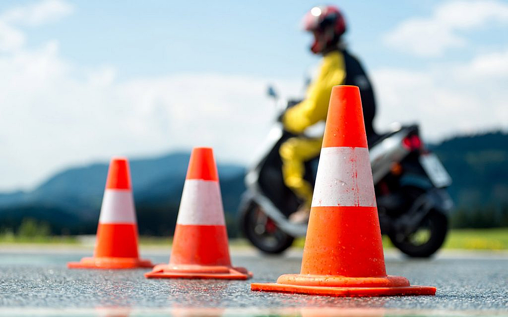 Student learning how to ride a motorcycle