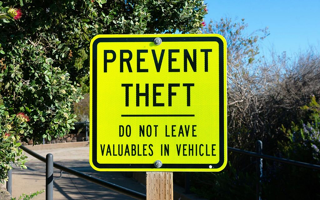 prevent theft sign on a board