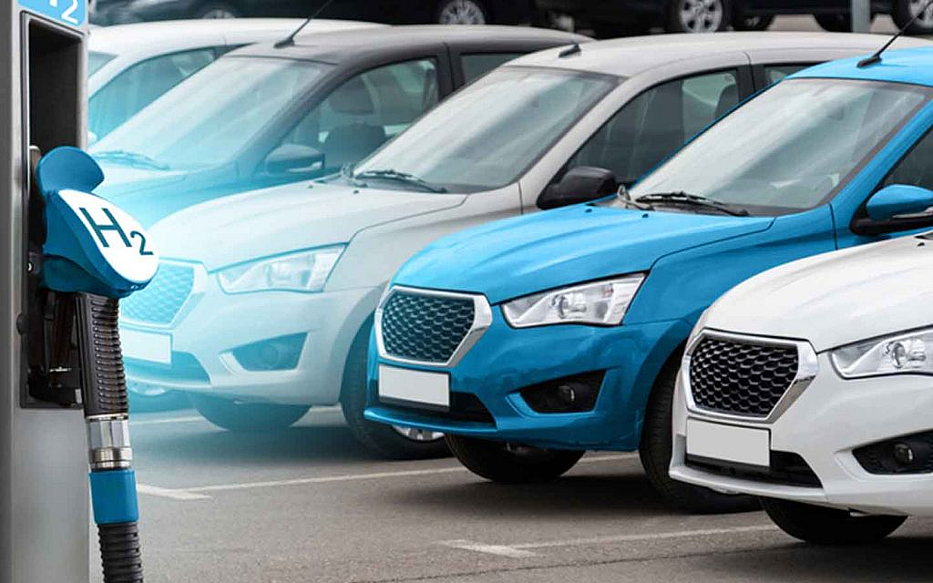 Hydrogen filling station with cars in the background