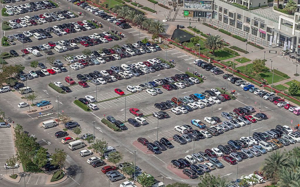 Several cars parked after showing a parking card in Dubai