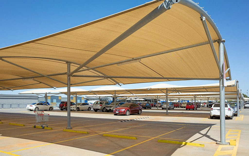 Drivers park their cars under the shade to minimize the effect of heat.