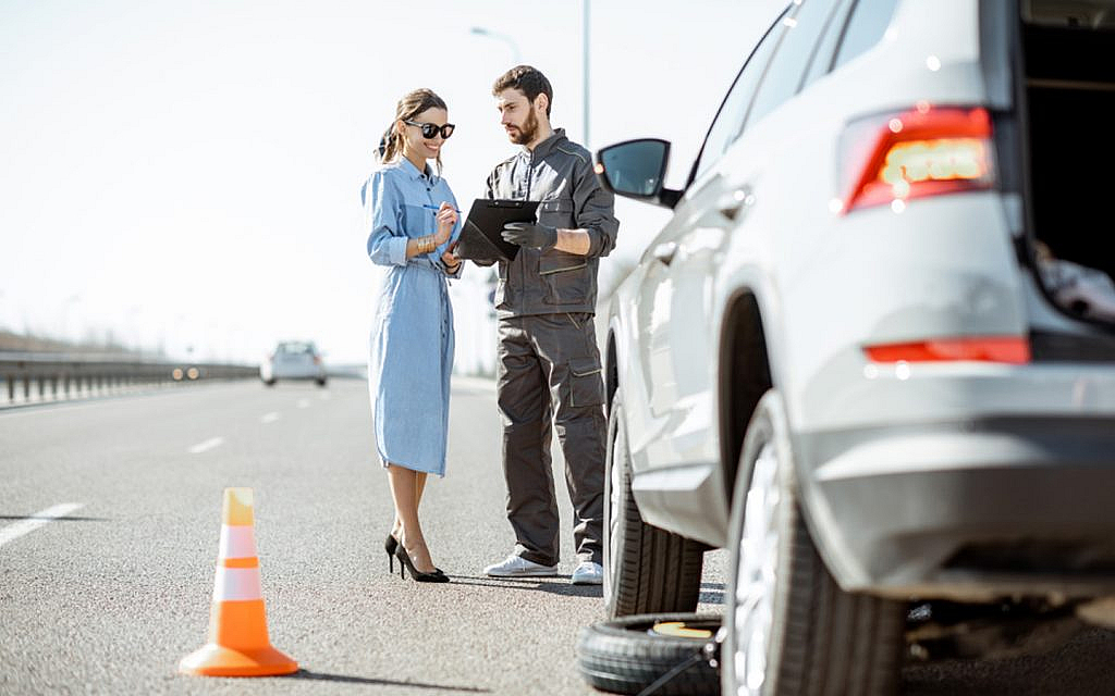 Roadside assistance helping a woman