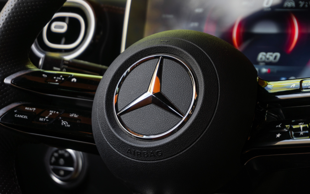 Mercedes-Benz silver logo on a black car