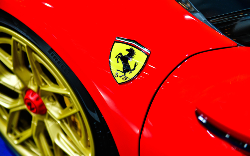 Yellow Ferrari logo on a red car
