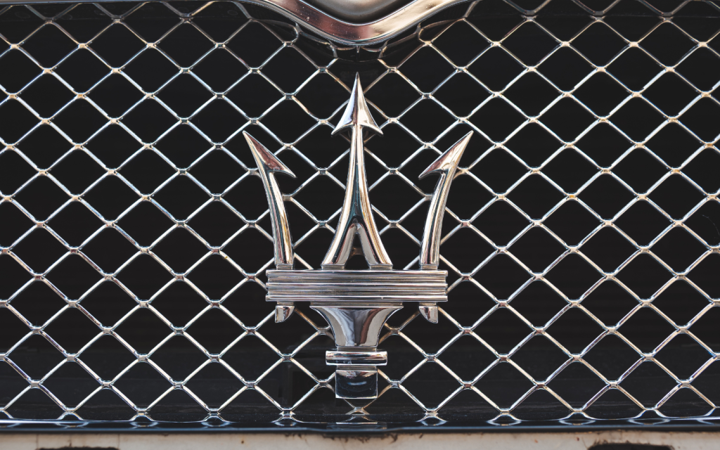 Silver coloured Maserati logo