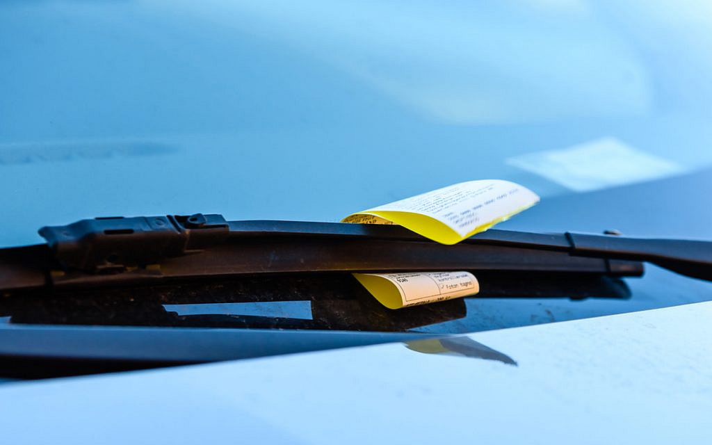 A parking fine on a vehicle