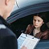 Women thinking How to contest a fine in the UAE after being fined for traffic violation