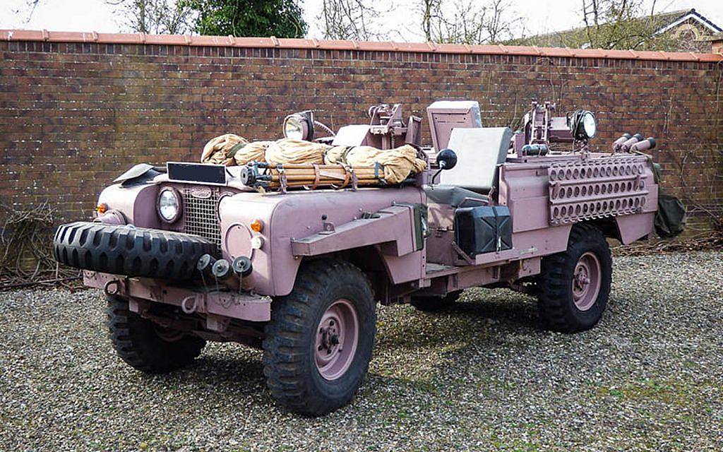 Land Rover Series IIA Pink Panther parked on a road