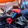 a man is taking car diagnostic test
