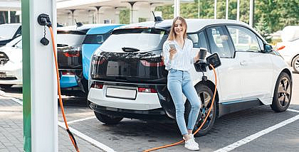 A girl owning an electric car in Dubai
