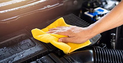 You can use WD40 for cleaning engine bay