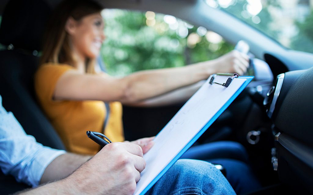 A girl is giving a driving test